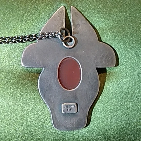Amber stone bull pendant